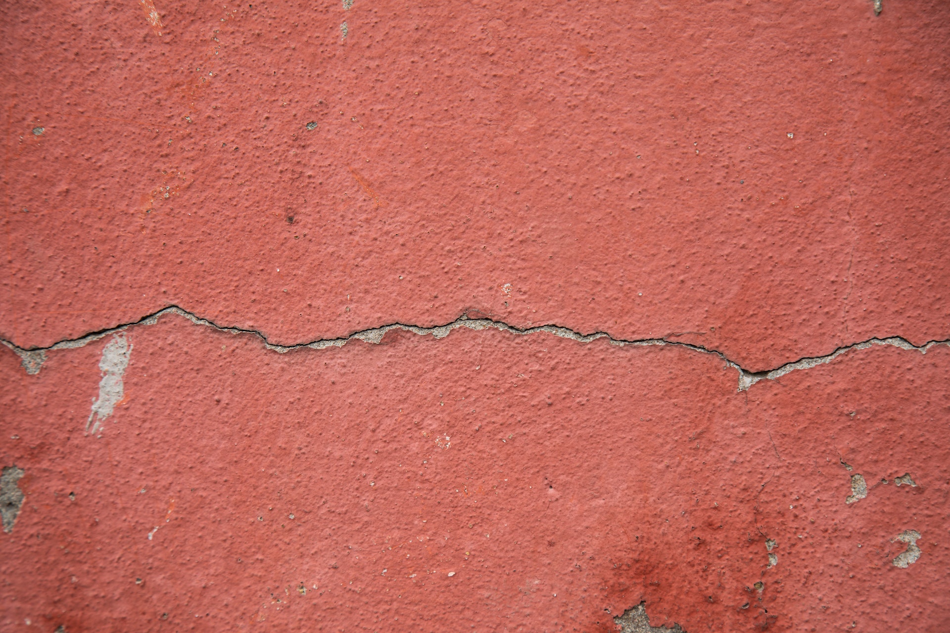 Crack in red stucco